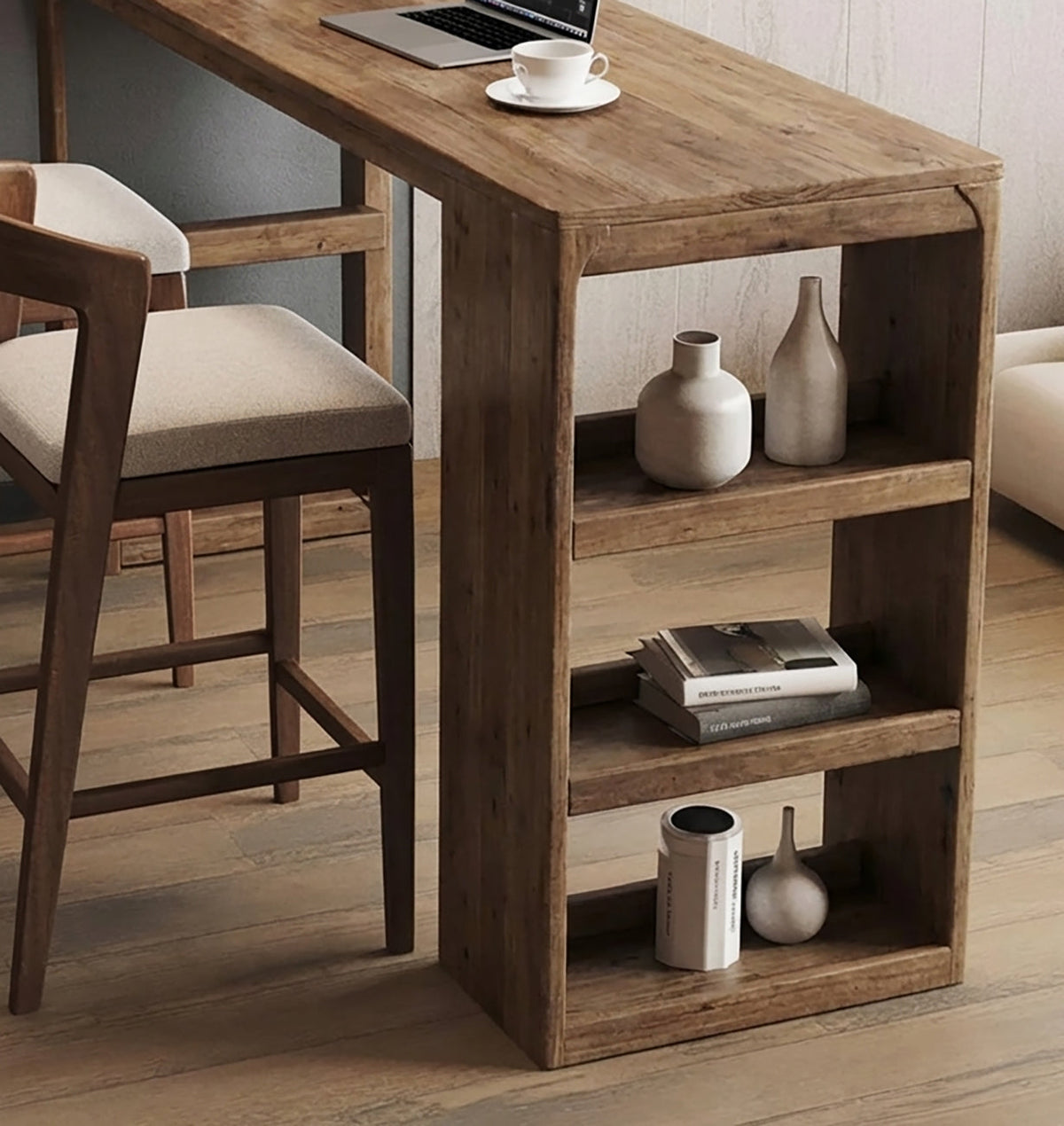 Natural wood bar table shelf stacked with ceramic vases and books next to upholstered bar stools