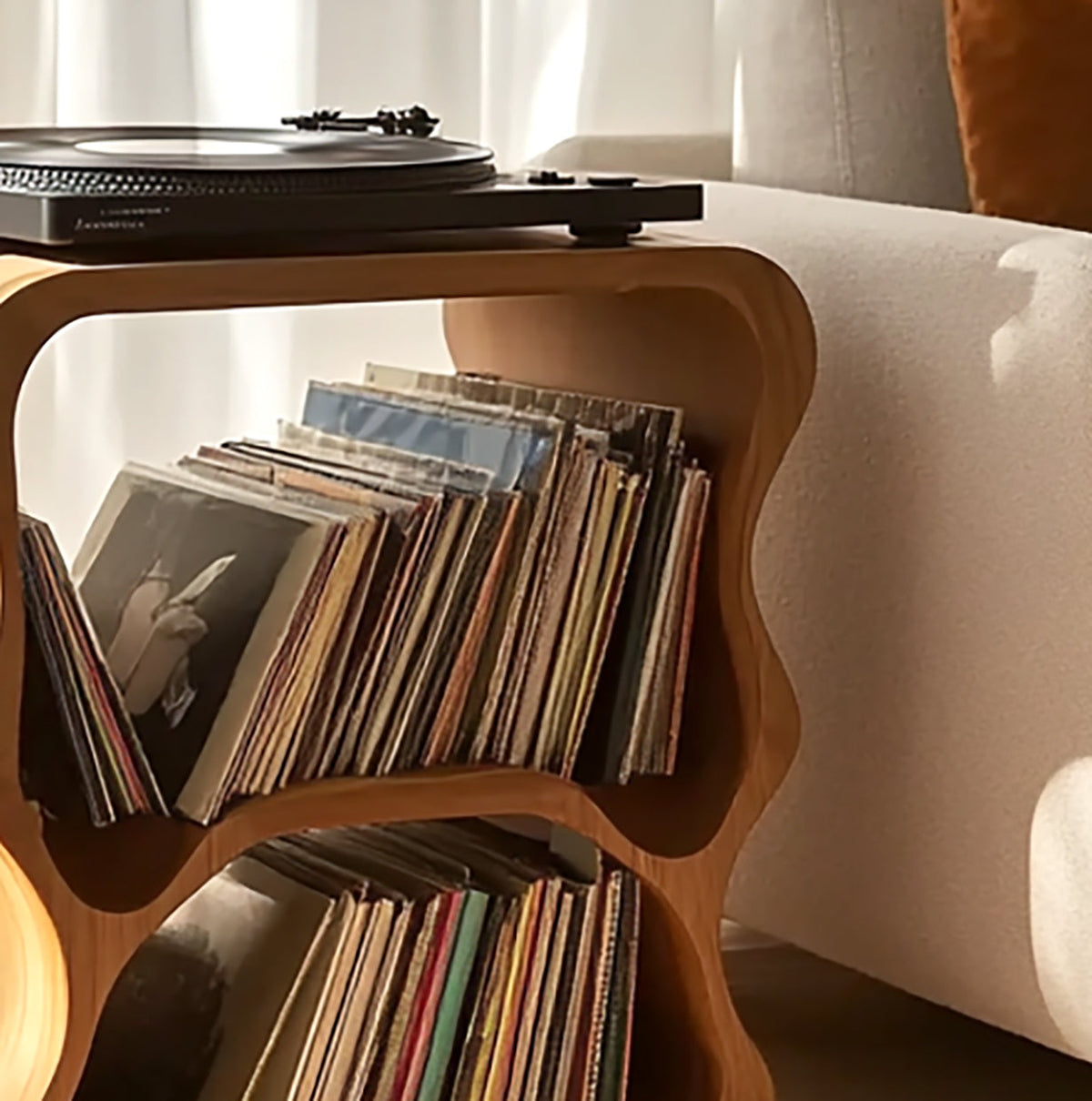 Unique solid wood record cabinet featuring curved wavy edges and two tiers of vinyl record storage