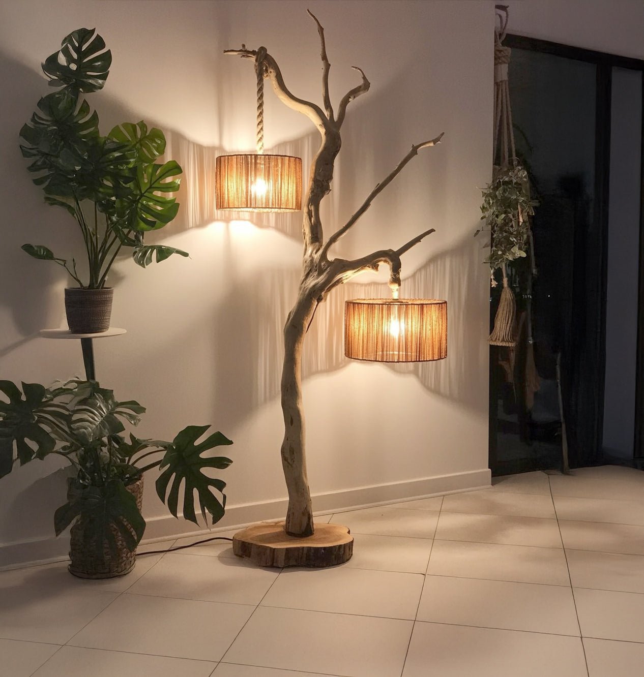 Rustic wooden floor lamp with two hanging wicker lampshades in modern living room with plants