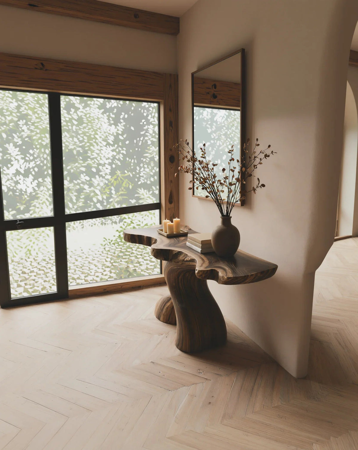 Live edge solid wood console table in modern entryway with candles, vase, and books.