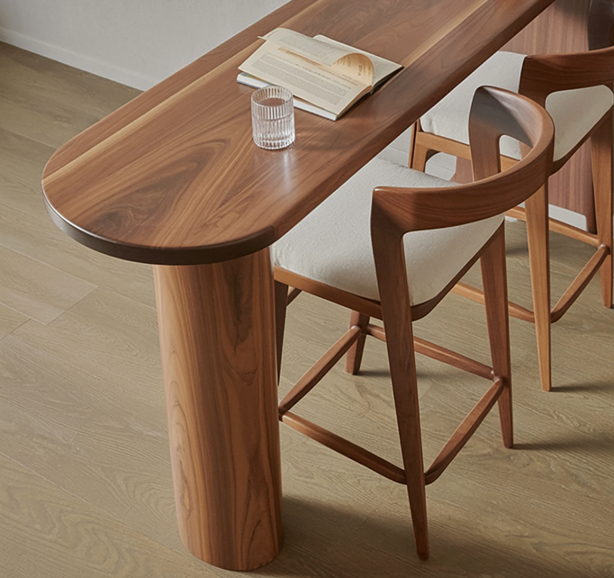 Handcrafted wooden dining and bar table with curved silhouette
