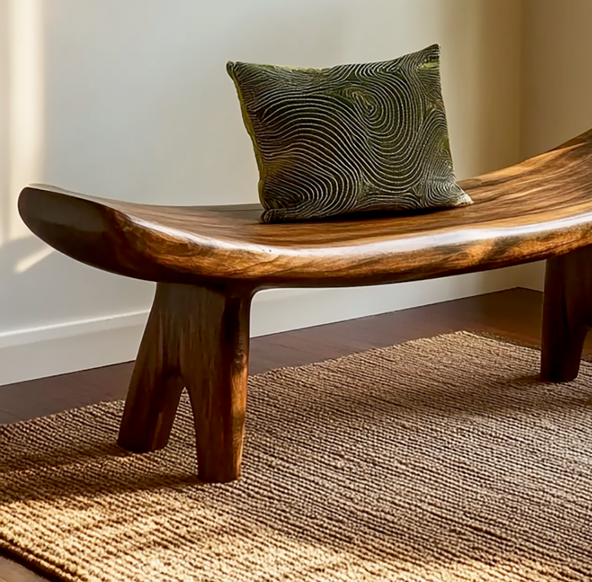 Sculptural solid wood bench with curved organic silhouette