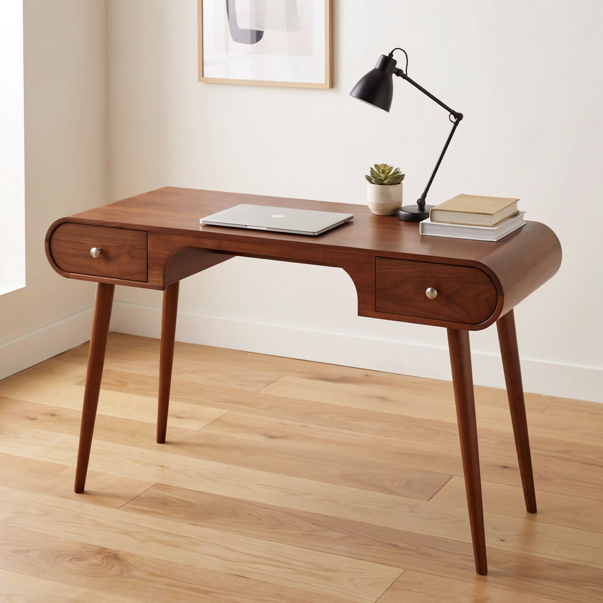 Modern sculptural desk crafted from premium solid wood with curved edges