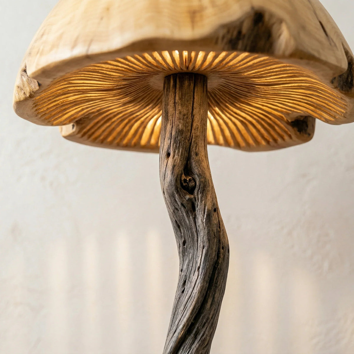 Hand-carved driftwood mushroom floor lamp with glowing wood dome and natural details