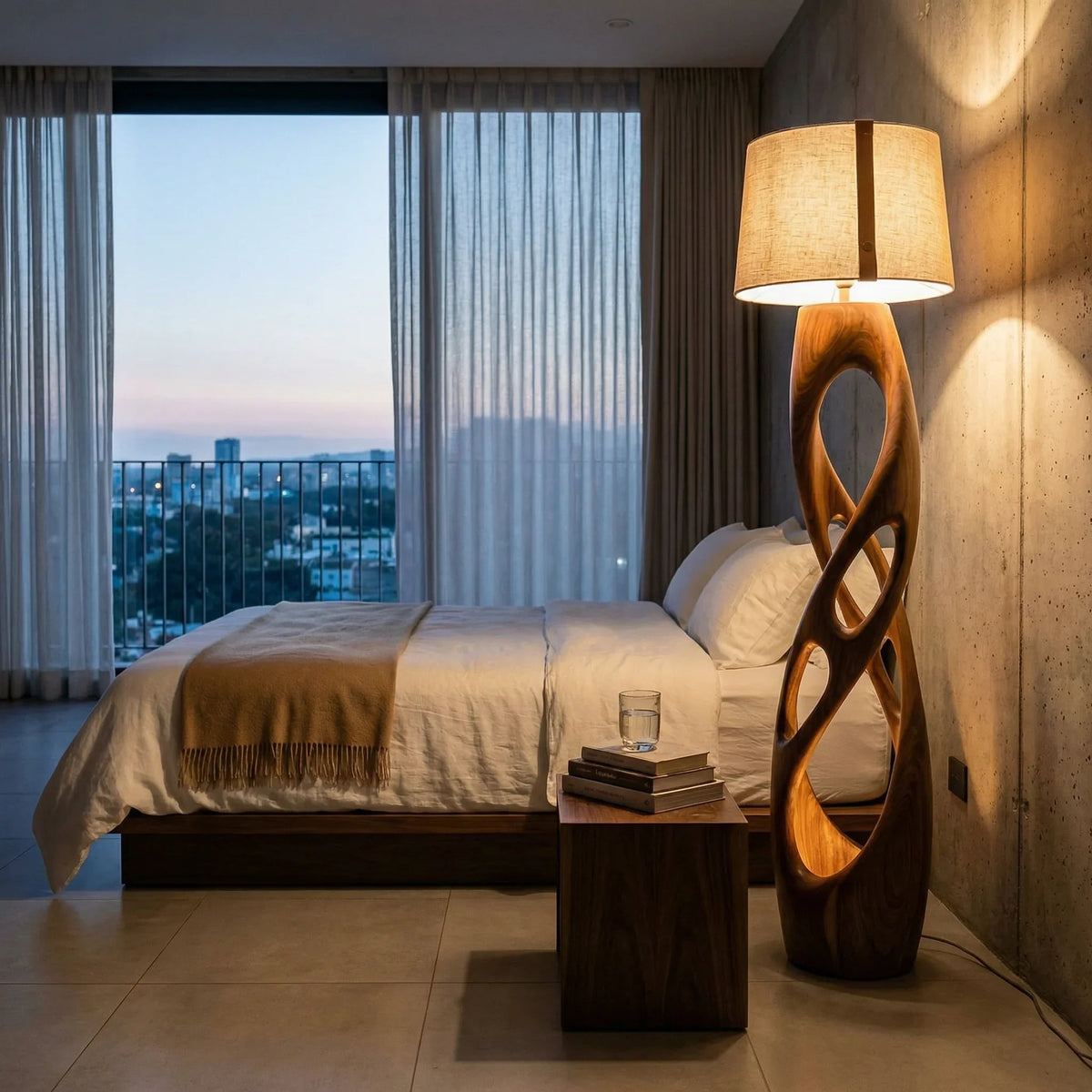 Luxury bedroom with minimalist bed, sculptural wood lamp, and modern wood nightstand