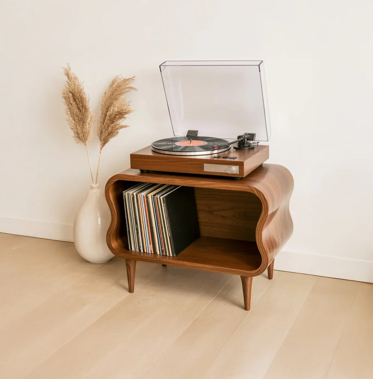 Solid wood record player stand with sculpted edges, vinyl storage, and modern decor