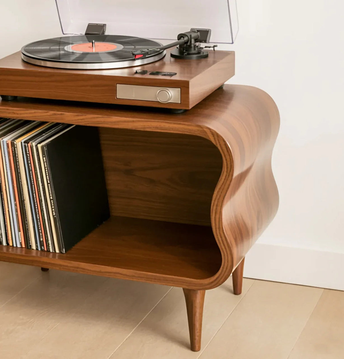 Solid wood record player stand with sculpted edges, vinyl storage, and modern turntable on top